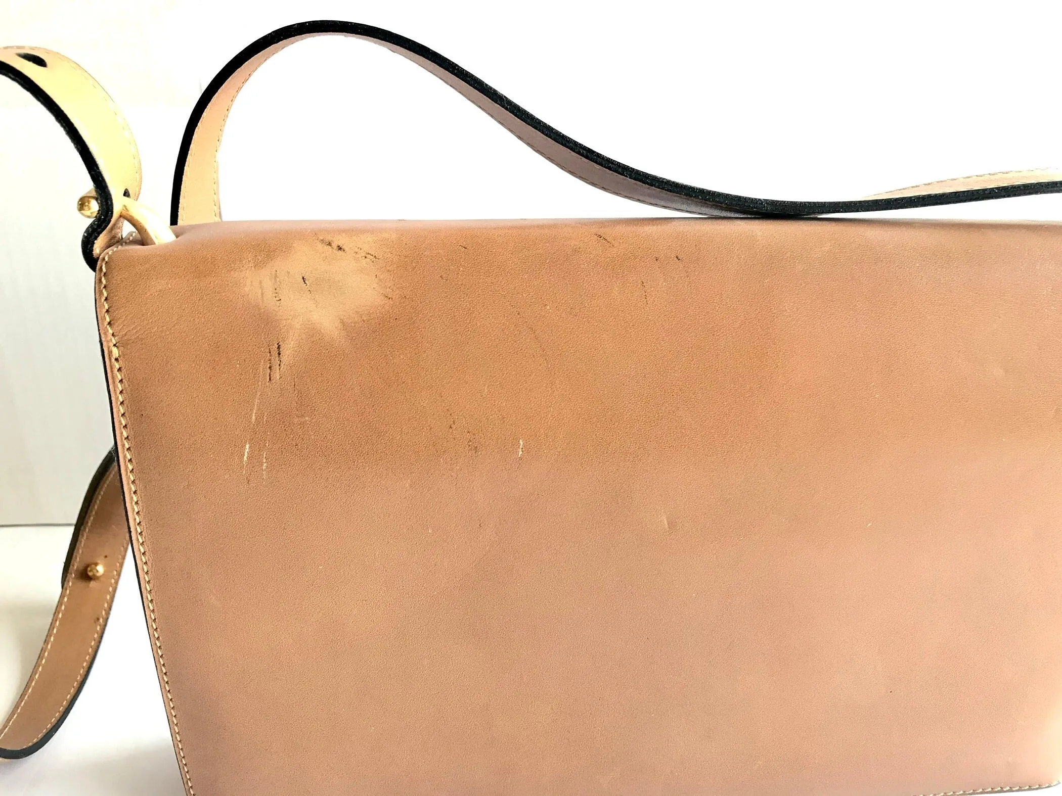 Vintage Christian Dior tanned brown leather shoulder clutch bag with golden CD motif.